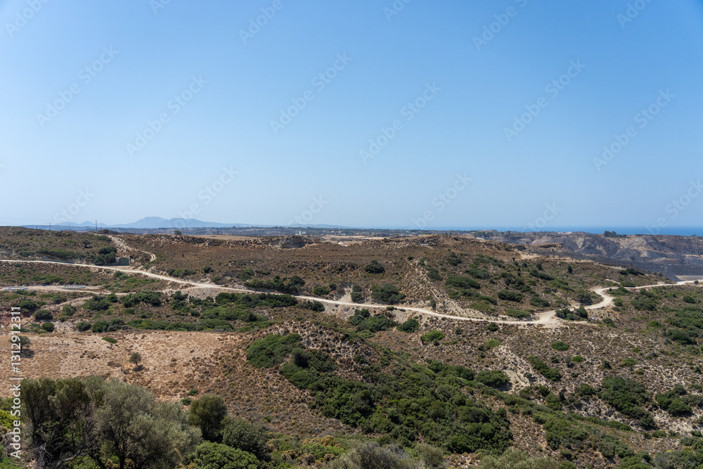 Obraz premium Scenic view to coast from high hills on Greek Island
