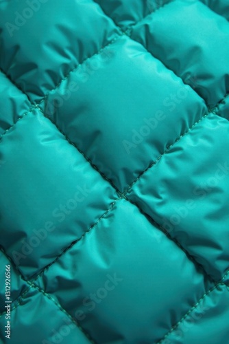 Close-up quilted turquoise sleeping bag Diamond stitch texture , fabric, turquoise
