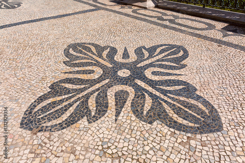 Obraz na płótnie Decorative Portuguese pavement with black and white stone patterns carved on the Miradouro de Santa Catarina in Lisbon, Portugal w salonie