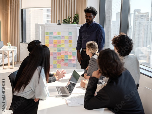 Diverse professional team collaborating on business strategy in modern office