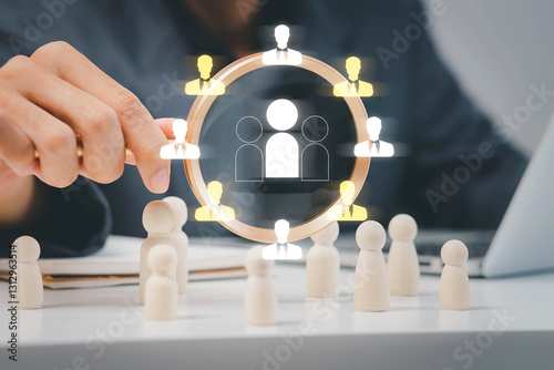 Businessman use magnifying glass to find human icon for business CRM or Customer Relation Management and customer focus target group concept, social media. Digital marketing online. HRM, human manage.