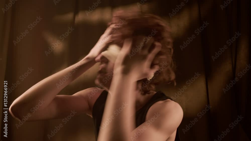 Chest-up shot of scared Caucasian young man wearing blindfold shaking his head in panic touching hair and face Chest-up shot of scared Caucasian young man wearing blindfold shaking his head in panic touching hair and face