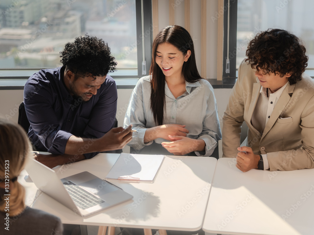 Diverse Business Team Collaborating on Project in Modern Office room