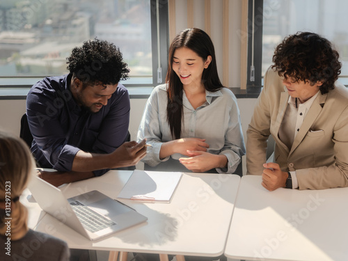 Diverse Business Team Collaborating on Project in Modern Office room