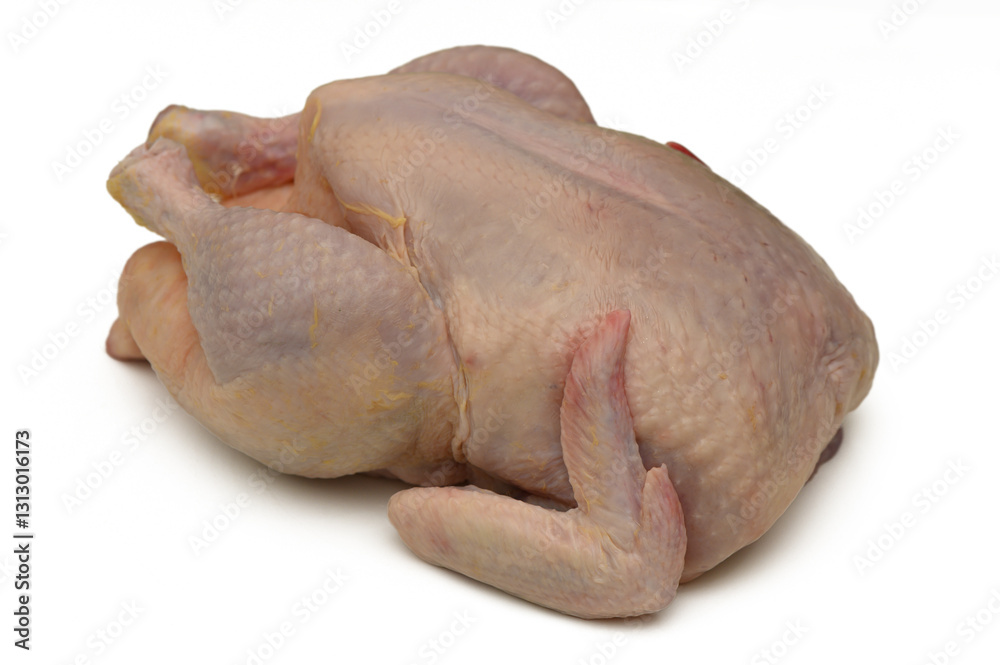 Freshly prepared uncooked chicken ready for cooking in a kitchen environment Freshly prepared uncooked chicken ready for cooking in a kitchen environment