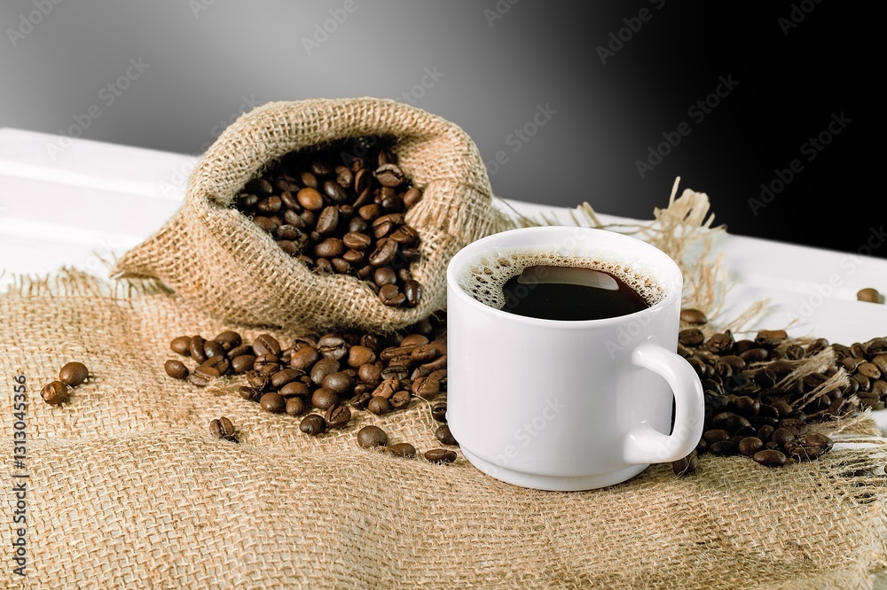Fotografie Coffee cup and aroma beans on background,