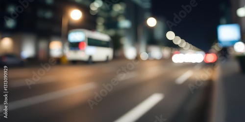 Motion-blurred city street with a single spotlight shining on the road creating a beautiful abstract white and gray bokeh effect  city street at night  nighttime ambiance