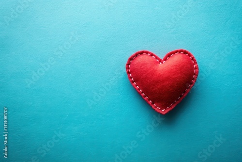 A Single Red Heart on a Teal Background, Representing Love and Affection