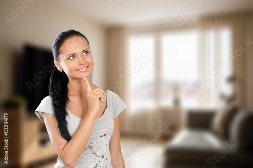 Free Download Portrait of a beautiful young woman posing in room - GFXLoad