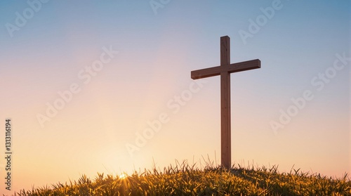 Sunlit Cross on a Hill at Sunrise