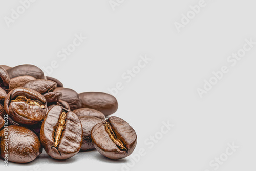 An abundant display of freshly roasted coffee beans in a clear space perfect for editorial and with a realistic appeal