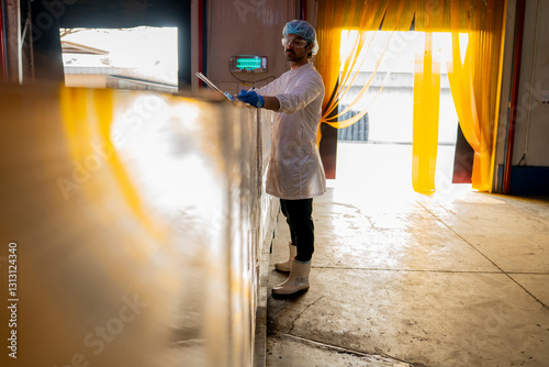 Inspector with clipboard supervising palletized goods in a storage facility Emphasis on quality assurance production processes and warehouse management in a professional environment