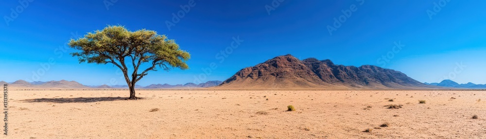 Resilient tree thriving in a parched desert landscape surrounded by sandy terrain and clear blue sky above Resilient tree thriving in a parched desert landscape surrounded by sandy terrain and clear blue sky above
