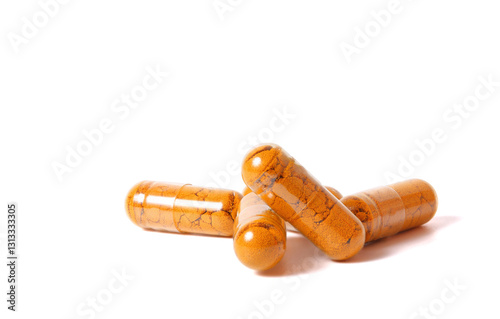 Turmeric powder in capsules. isolated on white background.