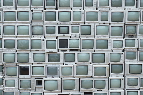 bunch of old computers stacked on top of each other