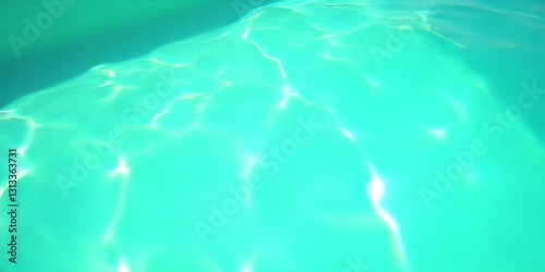 The shimmering surface of the blue water