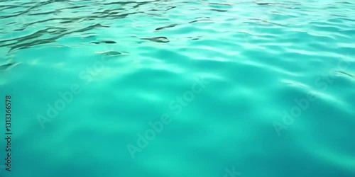 The shimmering surface of the blue water