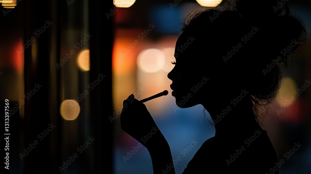 Fototapeta premium A woman is smoking a cigarette while looking at the camera