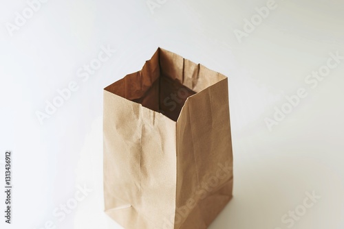A photo of a blank paper bag against a white background