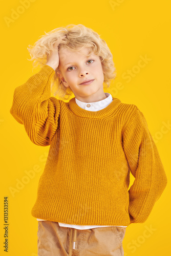kid in yellow sweater
