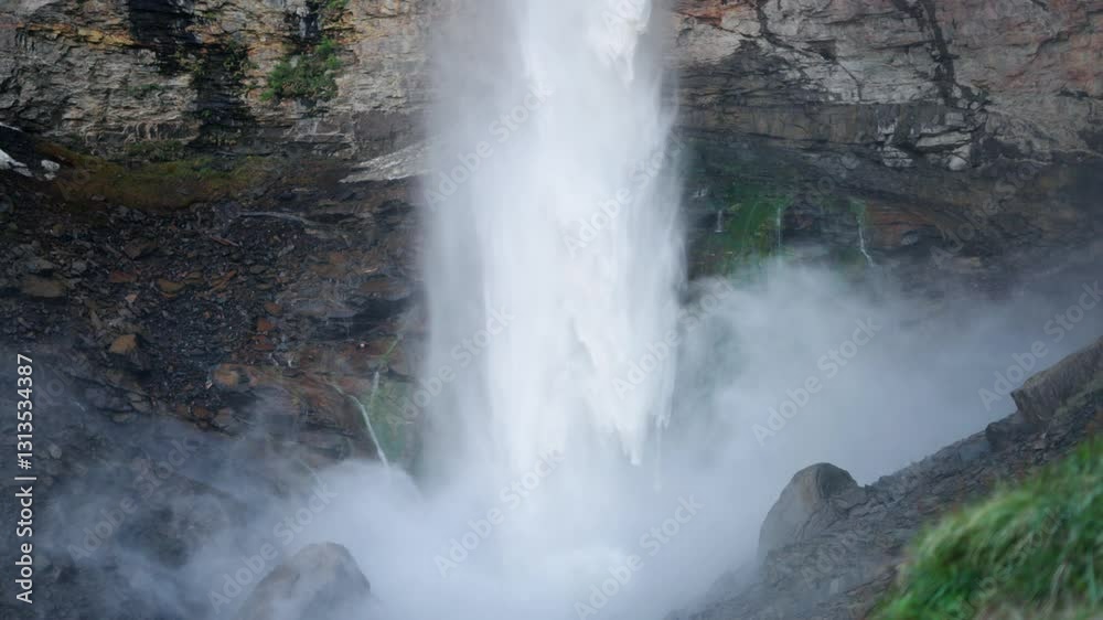 4K Slow motion shot of Sissu waterfall hitting the rocks below it after falling from the mountain and raising mist and fog in the air at Sissu village in Lahaul Valley, Himachal Pradesh, India. 4K Slow motion shot of Sissu waterfall hitting the rocks below it after falling from the mountain and raising mist and fog in the air at Sissu village in Lahaul Valley, Himachal Pradesh, India.