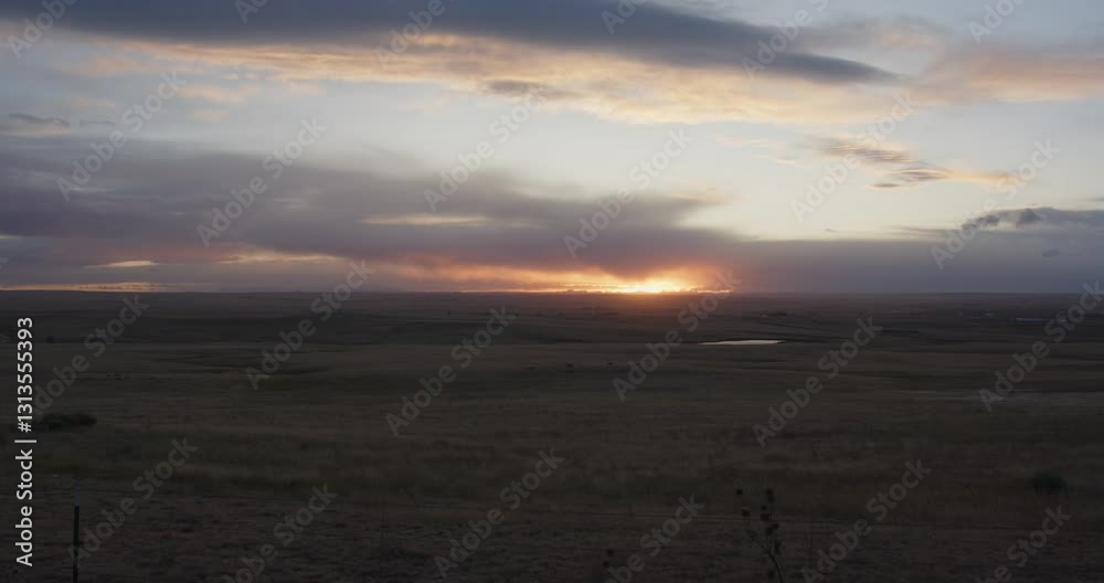 Wide static shot of a field landscape in Colorado at sunrise or sunset. For projects requiring longer clips in higher resolution, visit StockPlates. Wide static shot of a field landscape in Colorado at sunrise or sunset. For projects requiring longer clips in higher resolution, visit StockPlates.