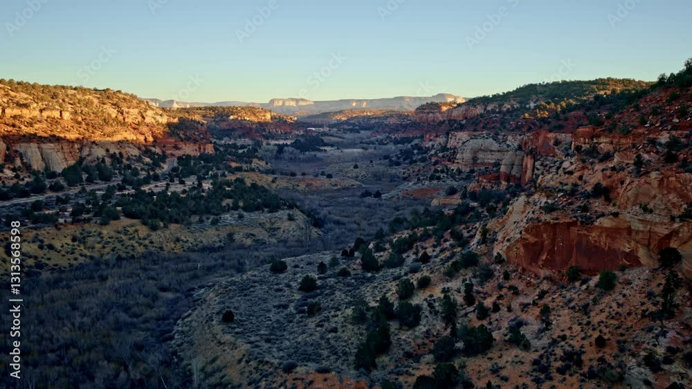 Aerial drone perspective showcasing the vast, rugged Canyonlands near Kanab at first light. Aerial drone perspective showcasing the vast, rugged Canyonlands near Kanab at first light.