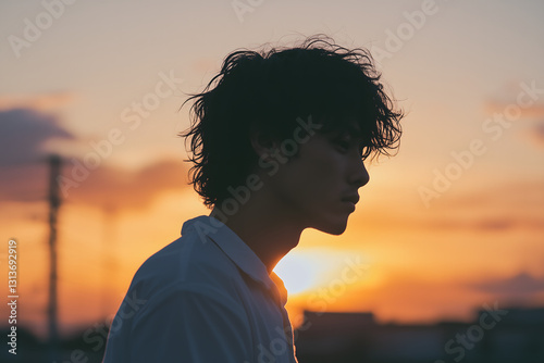 Man , Young man outdoors at sunset, Young man silhouette, portrait in profile on sunset light, Wanderlust guy under sunset