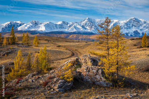 Wallpaper Mural Mountainous landscape with snow-covered peaks and yellow trees under blue sky during autumn Torontodigital.ca