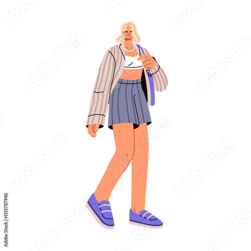 Modern young woman walking in casual summer outfit. Stylish girl in trendy st...