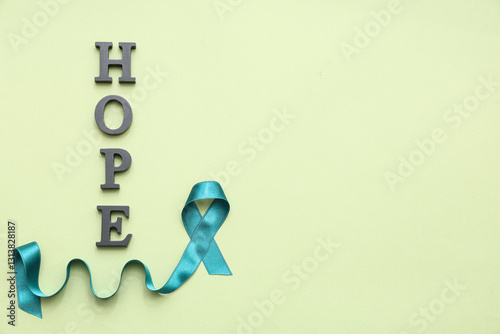 Teal ribbon and word HOPE o...