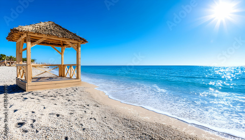 Idyllic beach scene with thatched gazebo  clear turquoise water  and bright sunshine