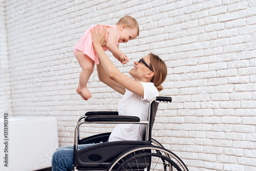 Disabled mother in wheelchair work with newborn