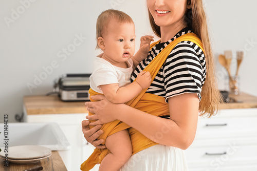 Happy young mother with lit...