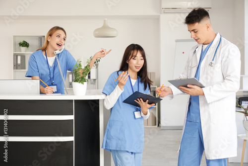Medical interns working nea...