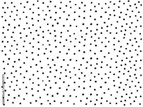不揃いに並べた手描きのモノクロ水玉模様背景