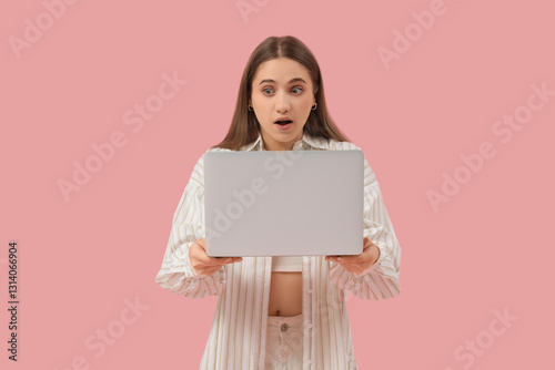 Young woman with laptop on ...