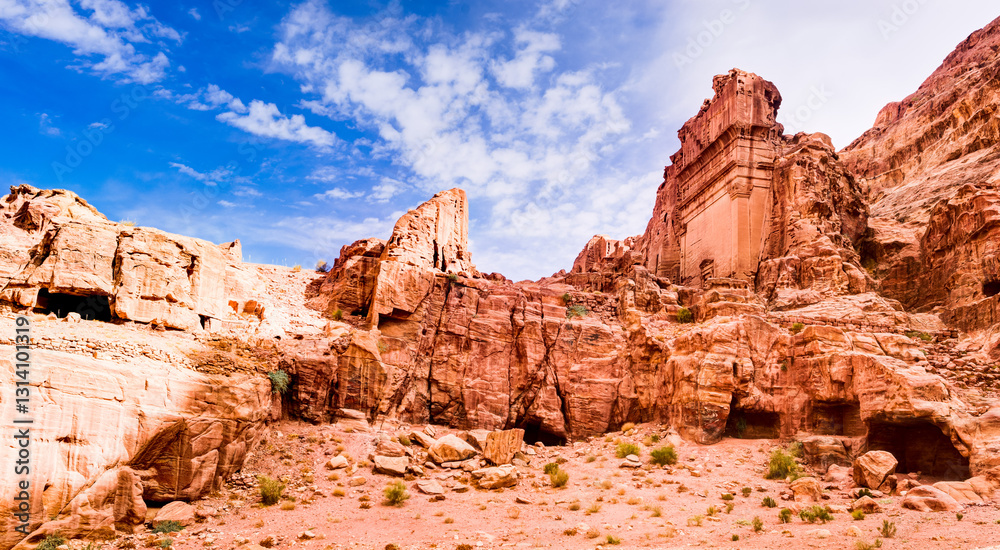 Fototapeta premium Low angle view of rock formations in Petra against blue sky