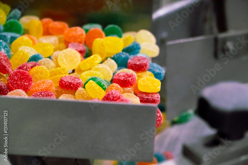 colourful gummy drops with sugar on the automated production line of a candy food industry