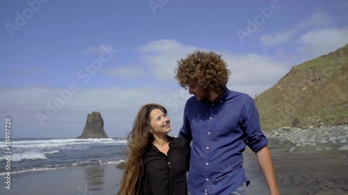 A couple in love by the sea. Romantic date on the ocean.