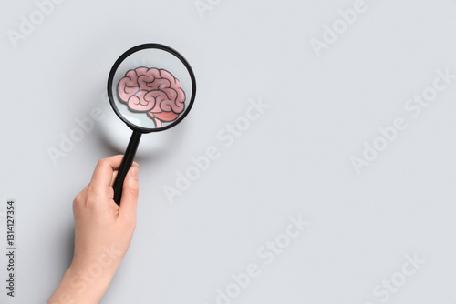 Female hand with magnifying...