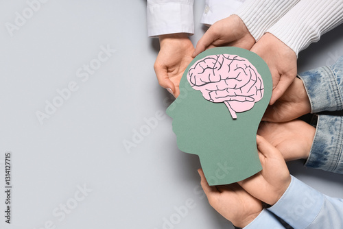 Women holding paper human h...