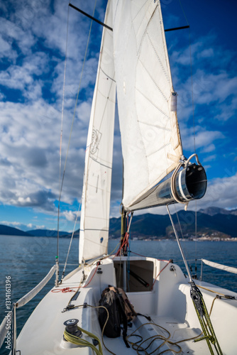 Sports yacht sailing in the Kotor Bay, Montenegro, representing adventure, freedom, and nautical exploration.