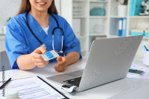 Female doctor with pills at...