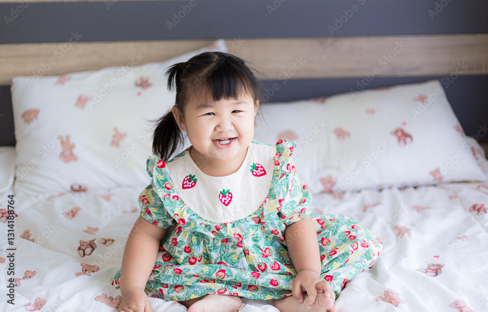 Cute Asian little girl and bright smile,Pretty asian little girl lying on the floor. Cute Asian little girl and bright smile,Pretty asian little girl lying on the floor.