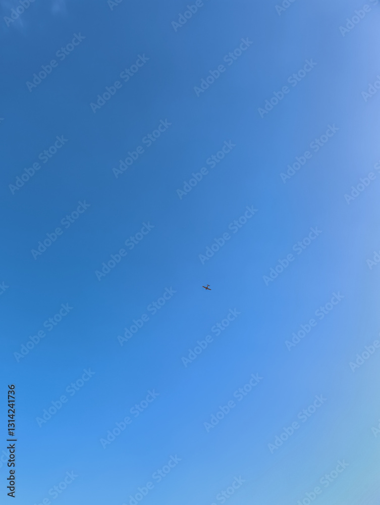 Small airplane flying in the clear blue sky of prague Small airplane flying in the clear blue sky of prague