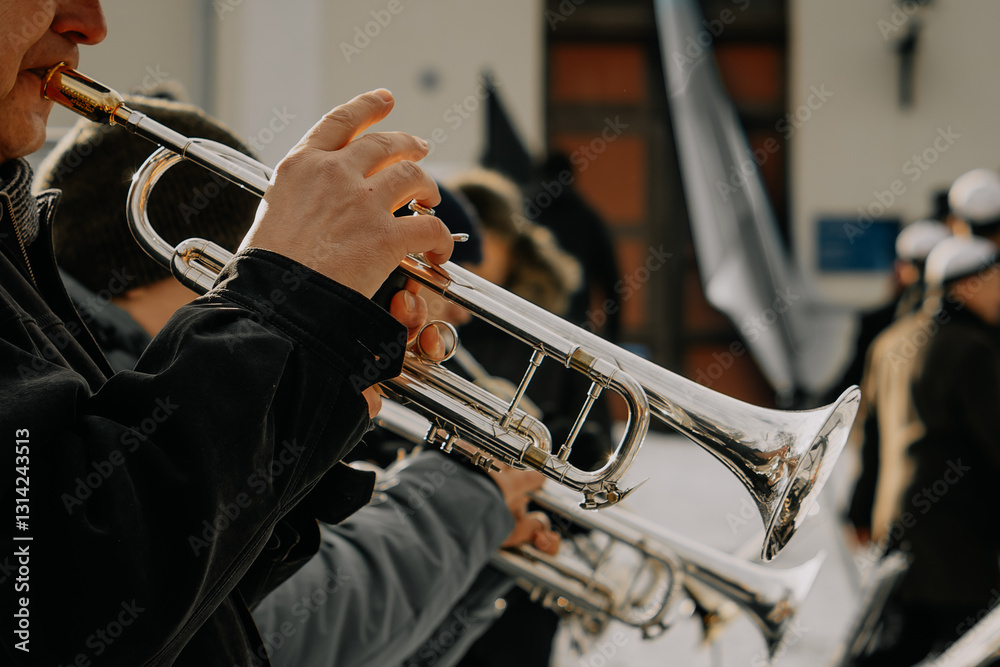 Obraz premium Talented musicians perform an elegant outdoor brass concert, playing French horns with skill and passion, creating a mesmerizing symphony of golden melodies.
