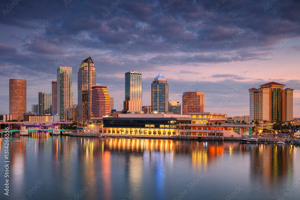 Tampa, Florida, USA. Aerial cityscape image of Tampa, Florida with reflection of the city skyline in the water at beautiful sunrise.