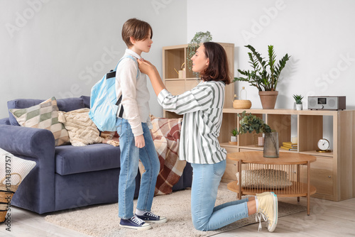 Mother getting her little s...