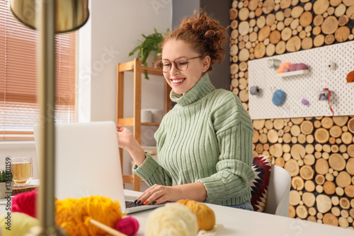 Young woman with laptop and...